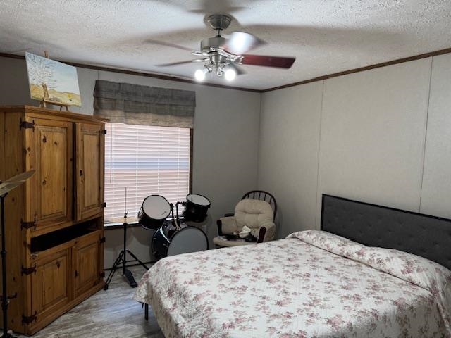 4216 Sandy Flat Road Bethel Springs, TN 38315 - Photo 4 of 15 a bedroom with a bed and wooden floor