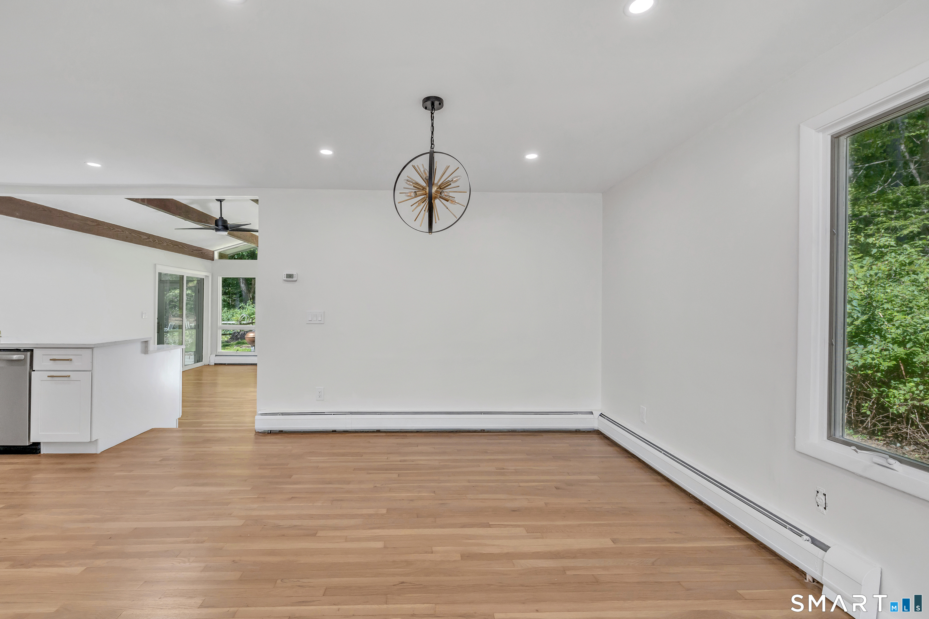 48 Crestwood Road Monroe, CT 06468 - Photo 13 of 32 a view of an empty room with wooden floor and windows