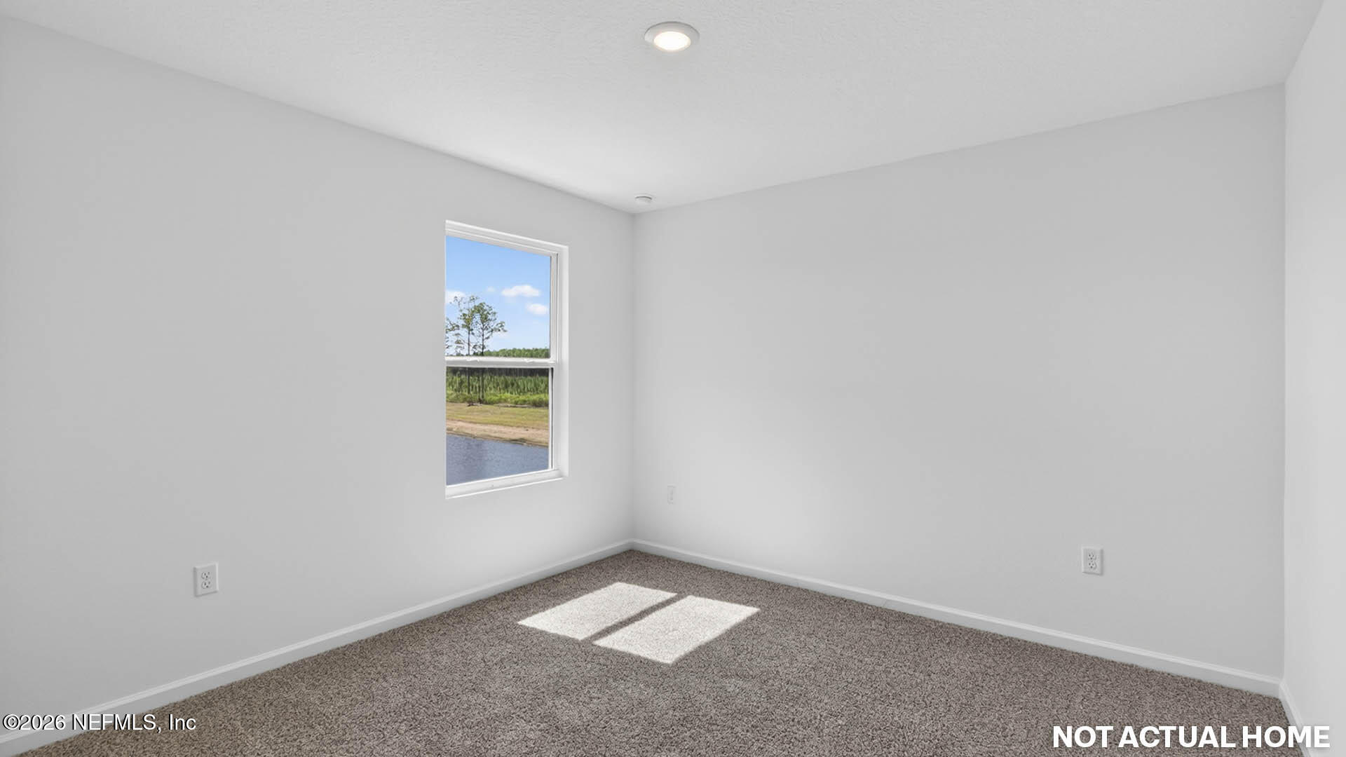 12095 Yew Tree Road Jacksonville, FL 32218 - Photo 29 of 61 a view of an empty room with a window