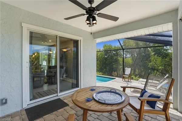 a view of a patio table and chairs in a room