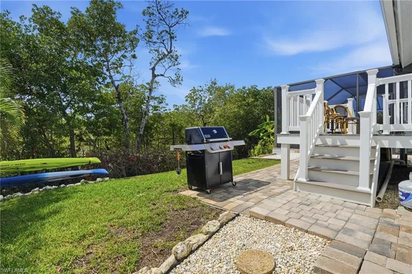 an aerial view of a house with a lake view
