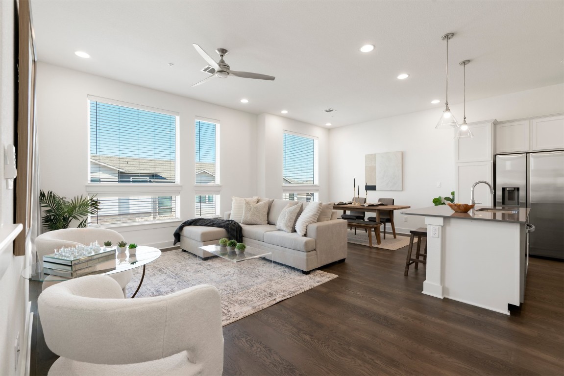 2050 Lohmans Spur Road, Unit 2203 Lakeway, TX 78734 - Photo 1 of 34 The living room opens up in a way that feels instantly inviting, with high ceilings and windows wrapping the space to bring in natural light from every angle