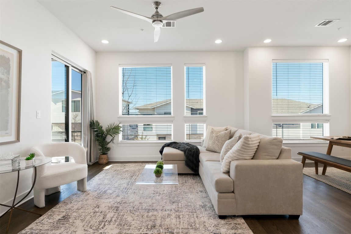 2050 Lohmans Spur Road, Unit 2203 Lakeway, TX 78734 - Photo 13 of 34 Surrounded by windows, the living room stays bright throughout the day, creating an easy connection to the outdoors without sacrificing privacy