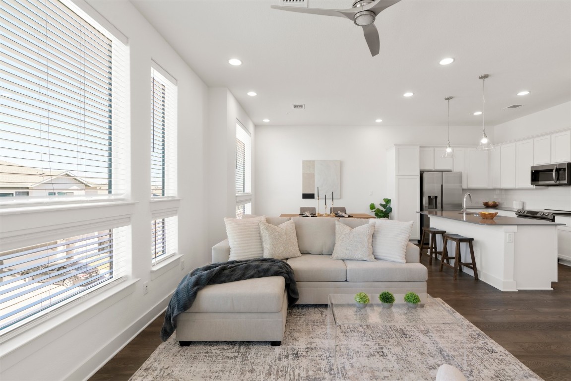 2050 Lohmans Spur Road, Unit 2203 Lakeway, TX 78734 - Photo 18 of 34 With the kitchen and dining areas nearby, the living room naturally becomes the gathering spot, keeping conversations flowing