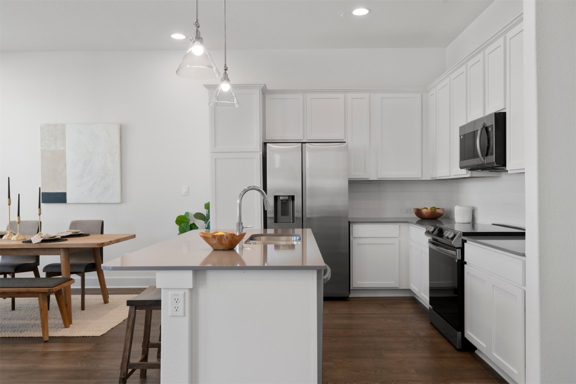 2050 Lohmans Spur Road, Unit 2203 Lakeway, TX 78734 - Photo 20 of 34 With an electric range and a streamlined layout, the kitchen is designed for someone who enjoys spending time here, whether cooking for one or hosting friends