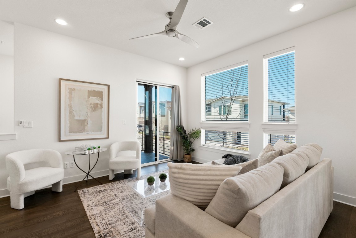 2050 Lohmans Spur Road, Unit 2203 Lakeway, TX 78734 - Photo 2 of 34 Hardwood floors run throughout the living area, grounding the room while giving you plenty of flexibility for furniture layouts, whether you’re hosting or winding down