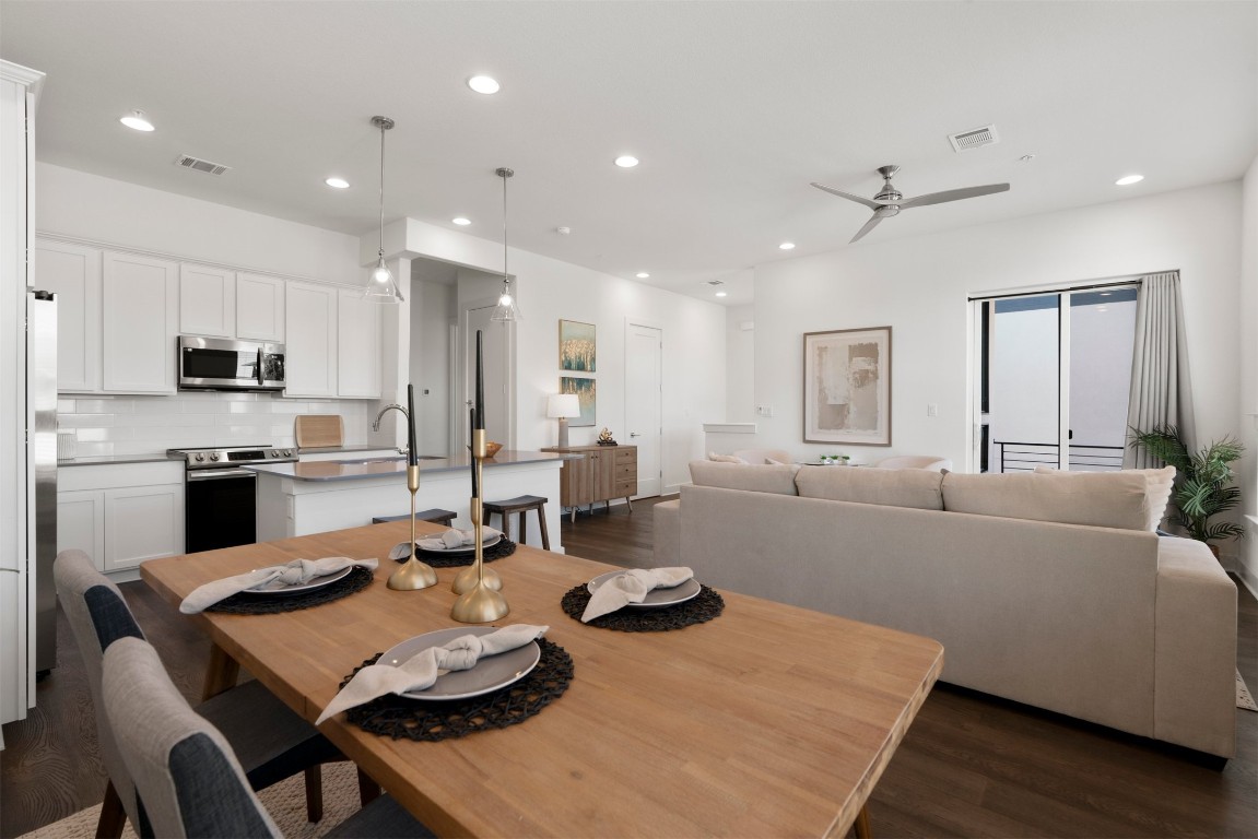 2050 Lohmans Spur Road, Unit 2203 Lakeway, TX 78734 - Photo 22 of 34 Wrapped in light from the surrounding windows, the dining space feels open and airy, with plenty of room for a full table