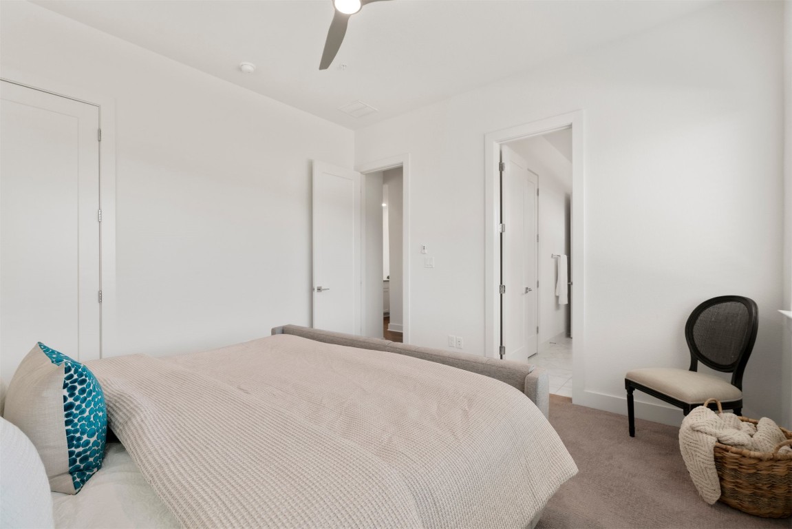 2050 Lohmans Spur Road, Unit 2203 Lakeway, TX 78734 - Photo 23 of 34 High ceilings and soft natural light give the bedroom an open, calming feel while still maintaining a sense of privacy from the main living areas