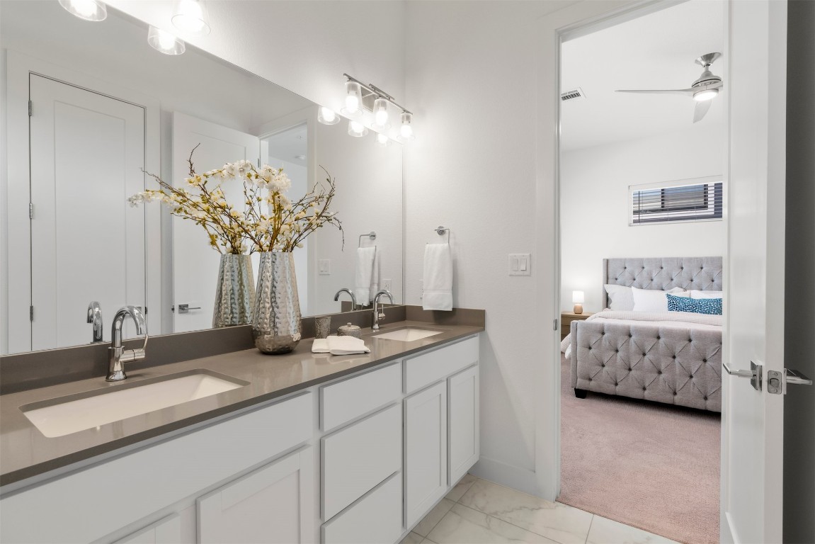 2050 Lohmans Spur Road, Unit 2203 Lakeway, TX 78734 - Photo 24 of 34 Thoughtful lighting and neutral finishes keep the bathroom feeling fresh and timeless, creating a space that feels just as good at night as it does in the morning