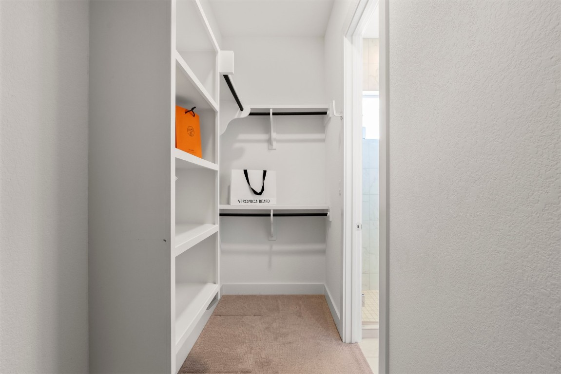 2050 Lohmans Spur Road, Unit 2203 Lakeway, TX 78734 - Photo 26 of 34 The walk-in closet offers generous storage and easy organization, with ample room for everyday essentials and seasonal pieces alike