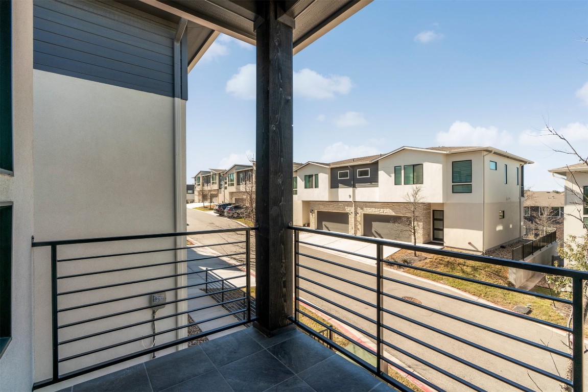 2050 Lohmans Spur Road, Unit 2203 Lakeway, TX 78734 - Photo 3 of 34 The balcony extends the living space outdoors, giving you a private spot to enjoy fresh air while staying connected to the heart of the home