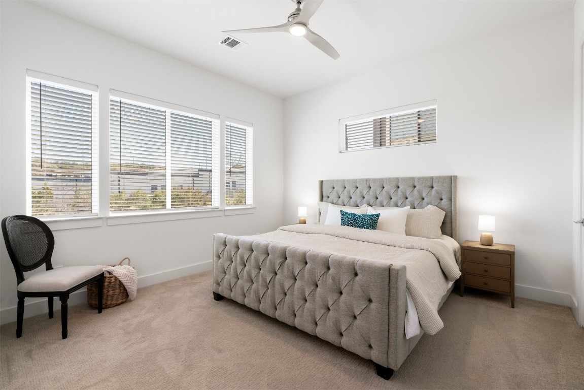2050 Lohmans Spur Road, Unit 2203 Lakeway, TX 78734 - Photo 6 of 34 The primary suite feels tucked away from the rest of the home, offering a spacious, quiet retreat with plenty of room to unwind at the end of the day