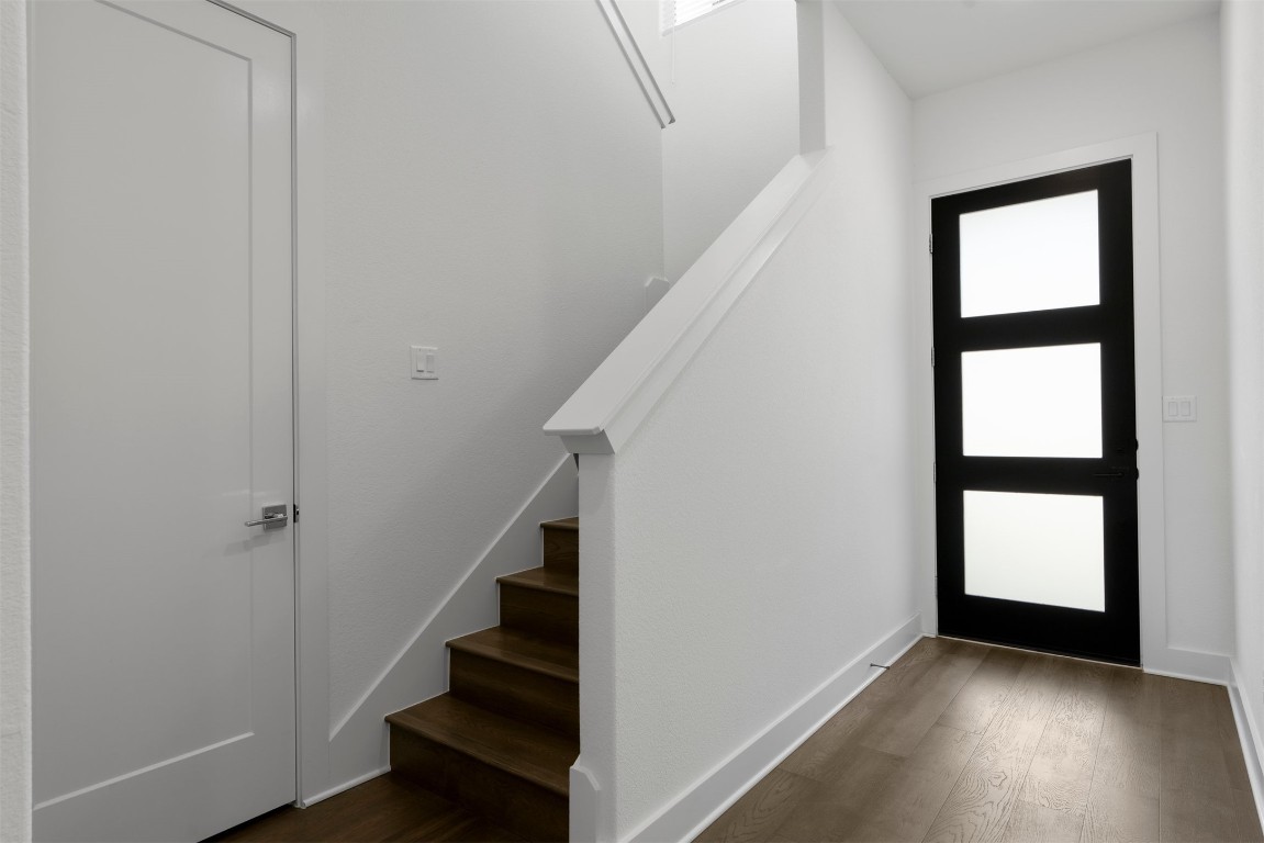 2050 Lohmans Spur Road, Unit 2203 Lakeway, TX 78734 - Photo 9 of 34 As you step into the first floor, the layout immediately feels intentional, with a calm, private atmosphere that separates the guest bedrooms from the main living spaces above, creating a welcoming entry