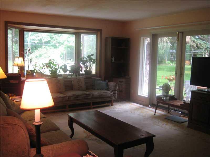 35 Easton Road Fox Chapel, PA 15238 - Photo 10 of 19 Living Room. Spacious room with hardwood floors, large bay window and patio door outside to rear yard.