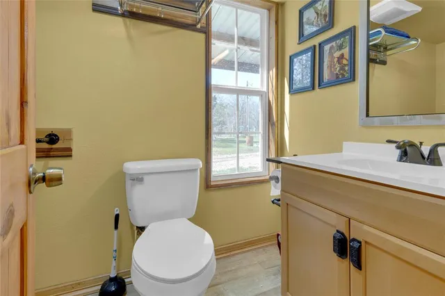 a bathroom with a toilet and a sink