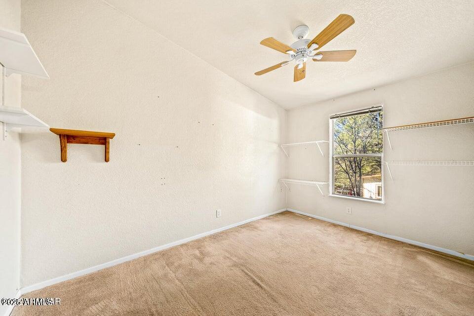 2421 West Thornton Road Show Low, AZ 85901 - Photo 32 of 48 a view of livingroom with ceiling fan