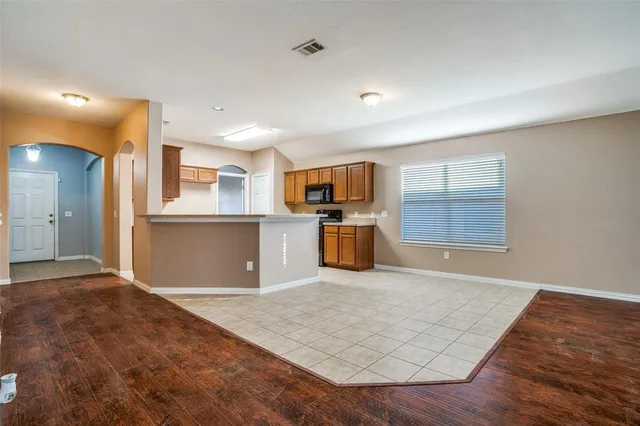a view of kitchen with wooden floor