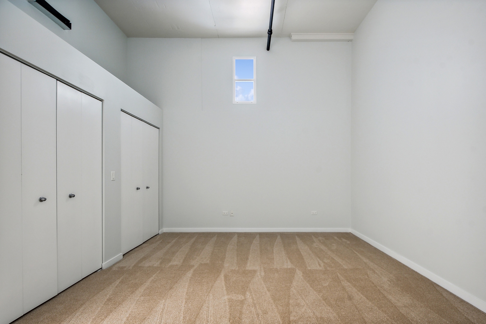 1224 West Van Buren Street, Unit 301 Chicago, IL 60607 - Photo 8 of 14 a view of a room with an empty space