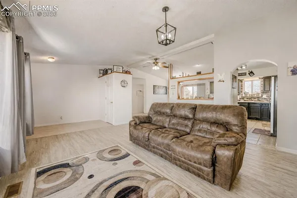 a living room with furniture and a window