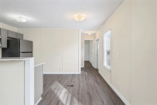 a view of a livingroom with wooden floor