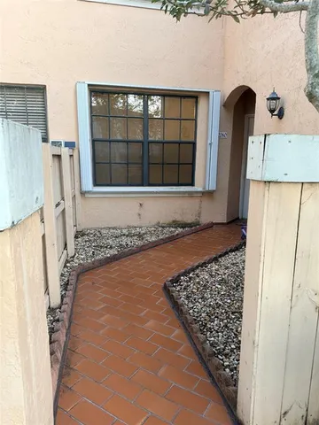 a view of a door in front of a house