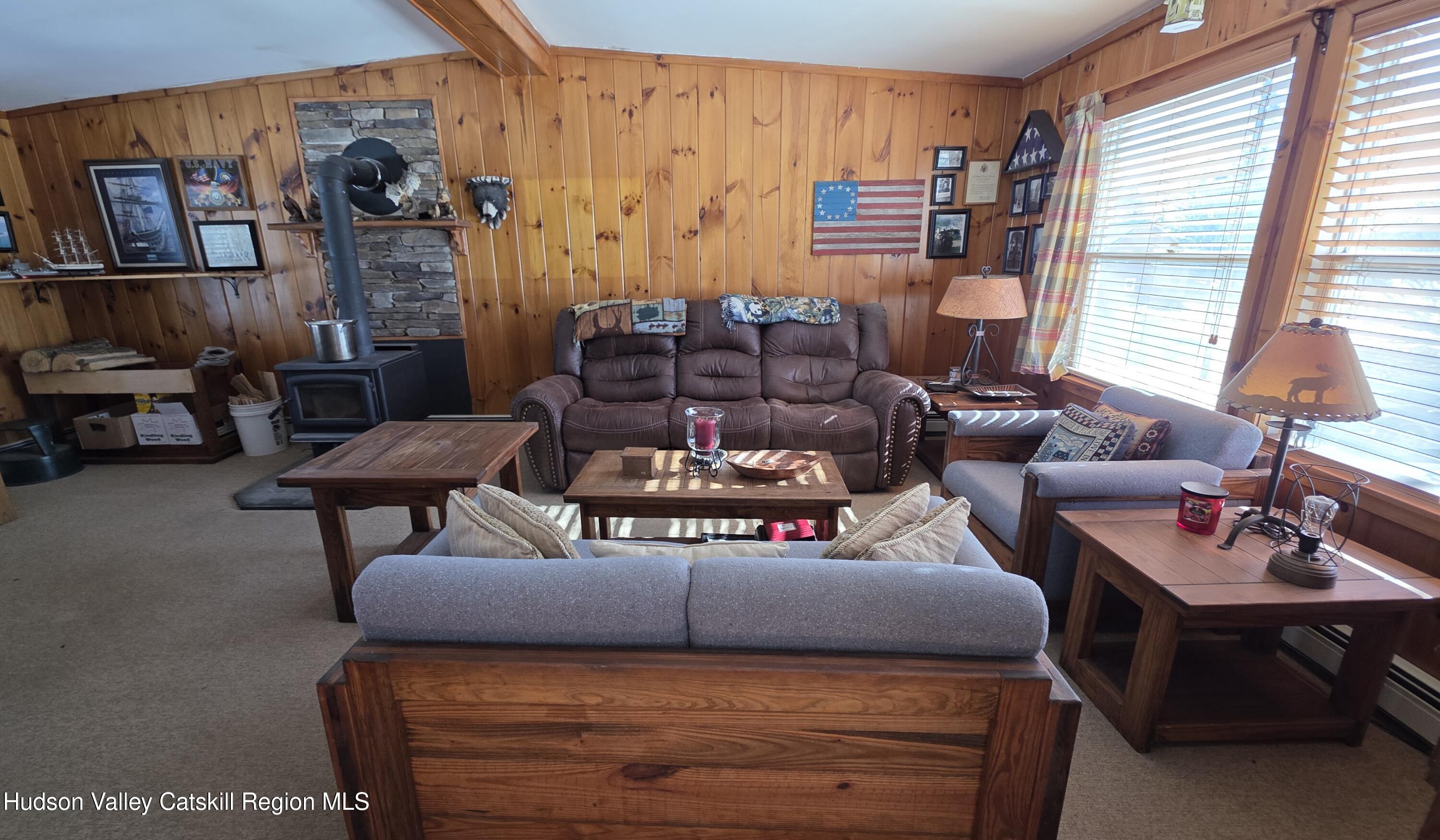 334 Stonitch Road East Durham, NY 12423 - Photo 16 of 46 a living room with furniture and a window