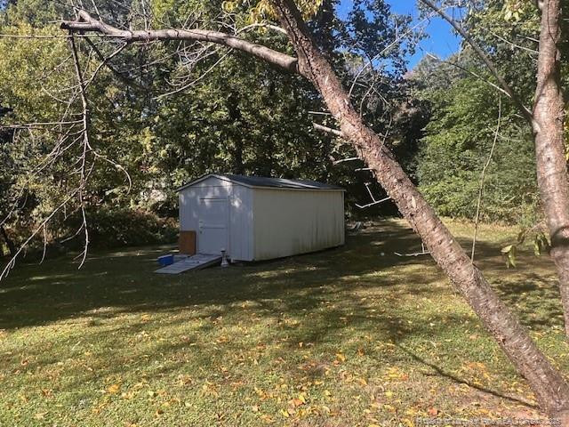 7905 Harps Mill Road Raleigh, NC 27615 - Photo 11 of 13 a backyard of a house with lots of green space