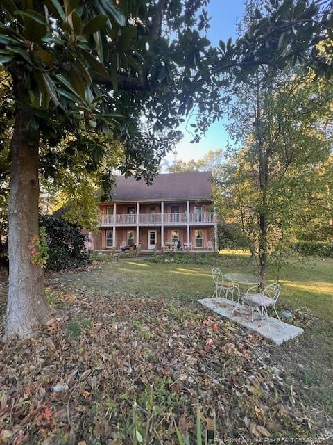 7905 Harps Mill Road Raleigh, NC 27615 - Photo 5 of 13 a view of a house with a yard