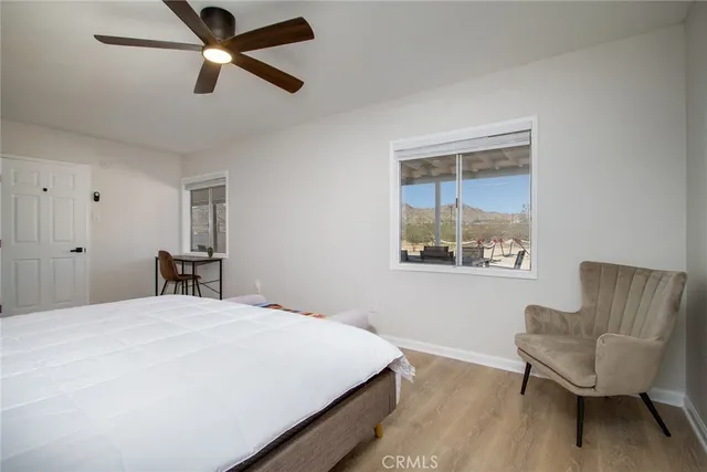 a bedroom with a bed and chair