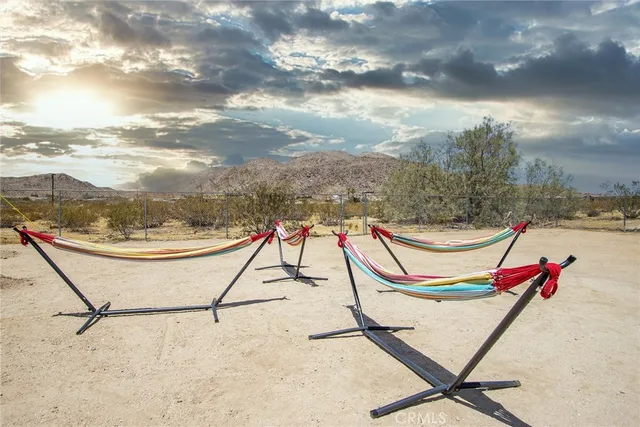 a backyard of a house with wooden fence