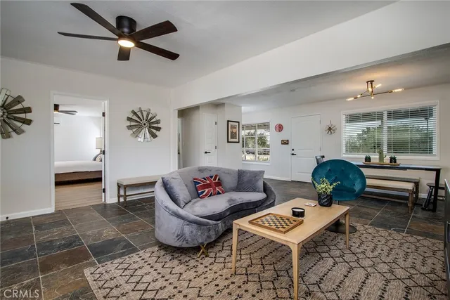 a living room with furniture and a window