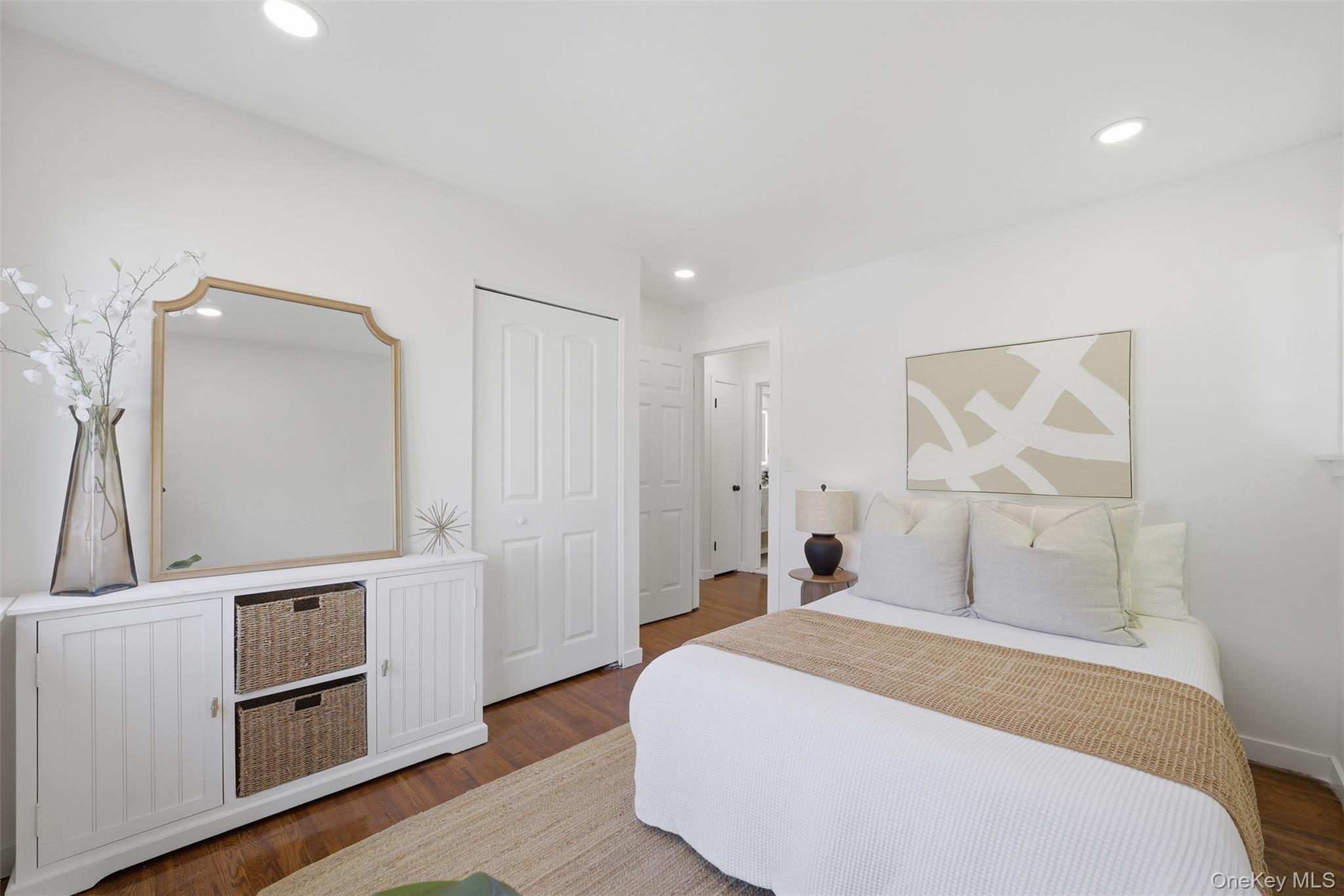 24 Fuller Road Ossining, NY 10562 - Photo 18 of 48 a bedroom with a bed and a large mirror