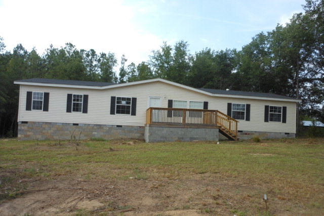 4157 Sandy Point Road, Unit 5960 Lizella, GA 31052 - Photo 1 of 1 a view of a house with a yard
