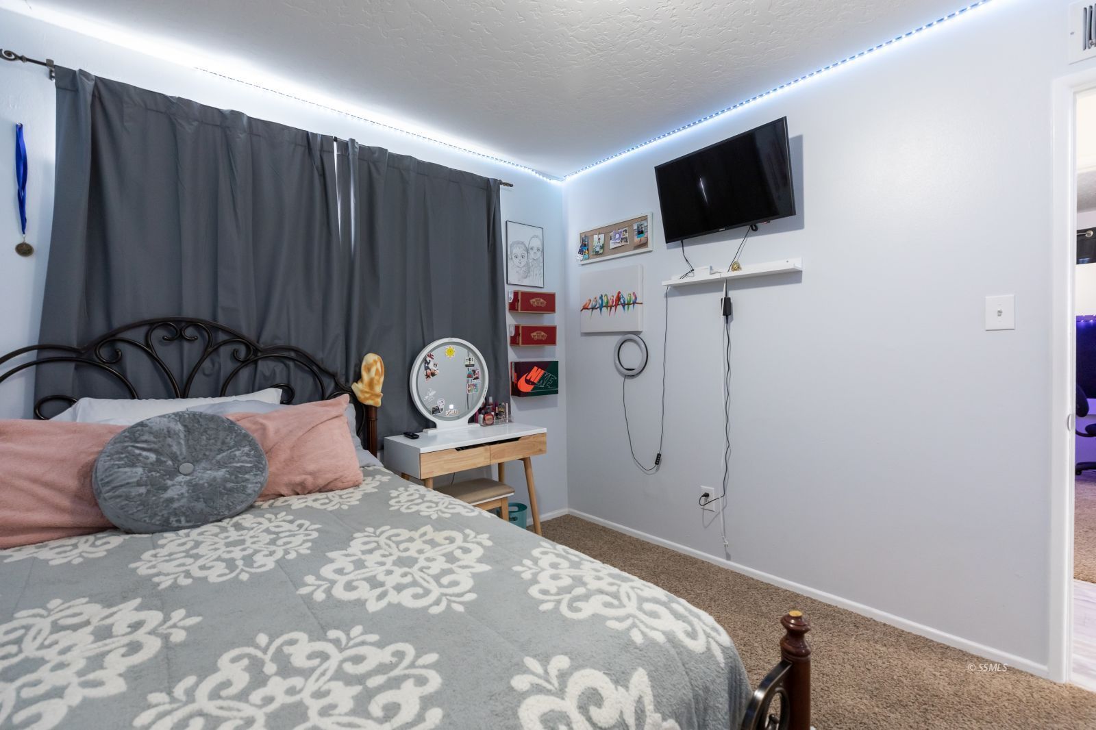 317 South Silver Ridge Street Ridgecrest, CA 93555 - Photo 24 of 28 a bedroom with a bed and a flat screen tv