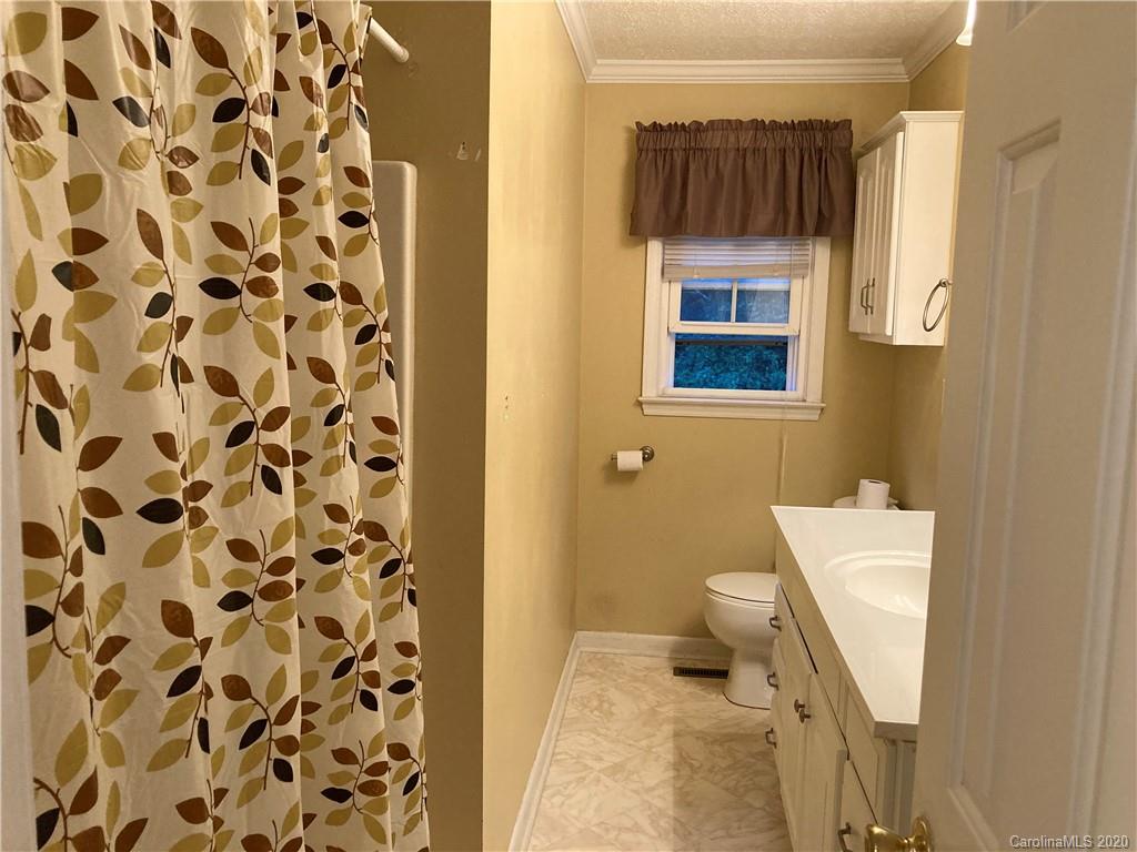 1851 Stoney Point Road Shelby, NC 28150 - Photo 12 of 26 a bathroom with a sink and a mirror