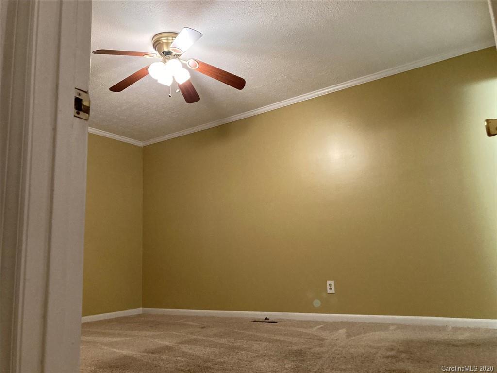 1851 Stoney Point Road Shelby, NC 28150 - Photo 13 of 26 a view of a room with a ceiling fan and hardwood floor