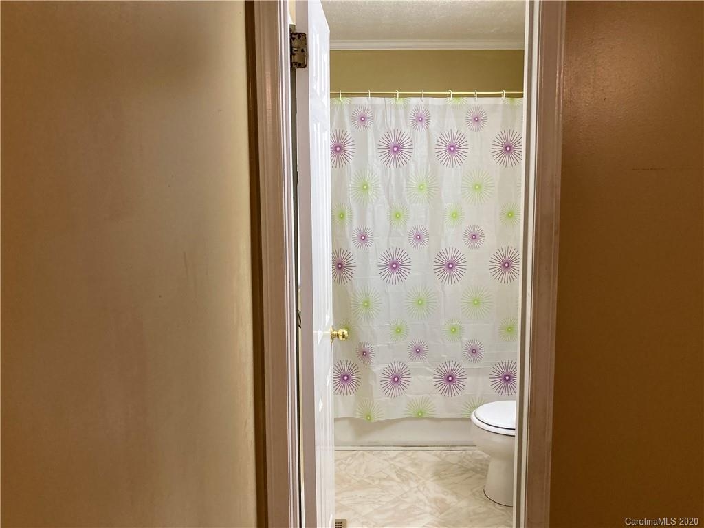 1851 Stoney Point Road Shelby, NC 28150 - Photo 15 of 26 a bathroom with a shower and a toilet