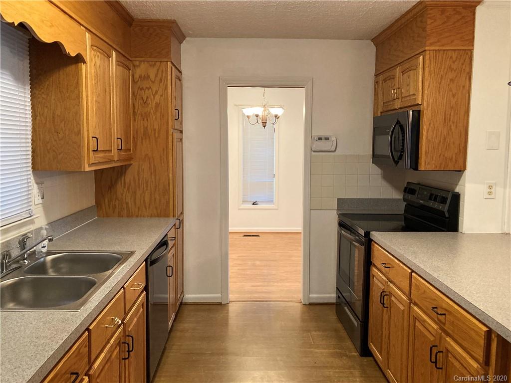 1851 Stoney Point Road Shelby, NC 28150 - Photo 7 of 26 a kitchen with a sink stove top oven and refrigerator
