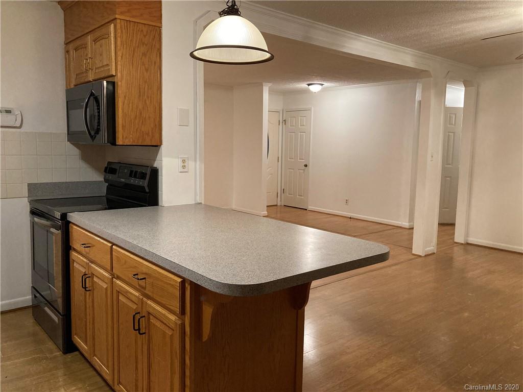 1851 Stoney Point Road Shelby, NC 28150 - Photo 8 of 26 a view of kitchen island with wooden floor