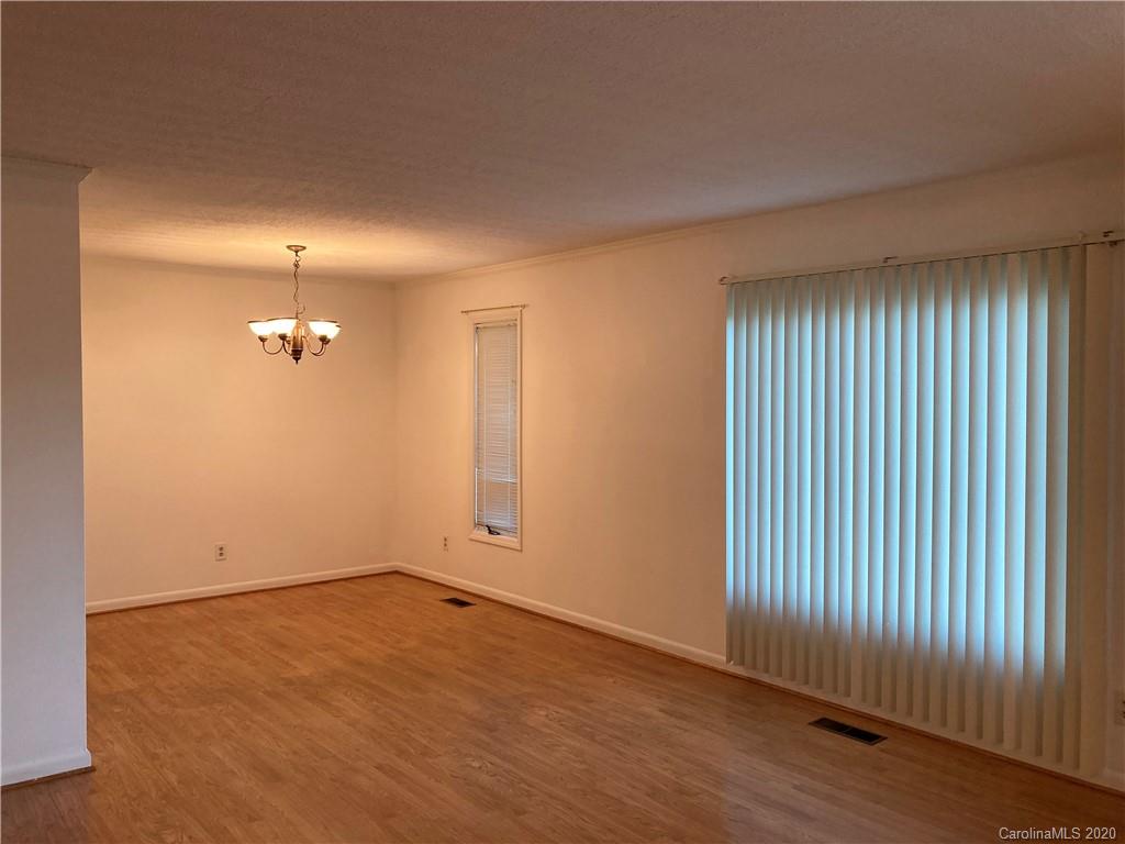 1851 Stoney Point Road Shelby, NC 28150 - Photo 9 of 26 wooden floor in an empty room with a window