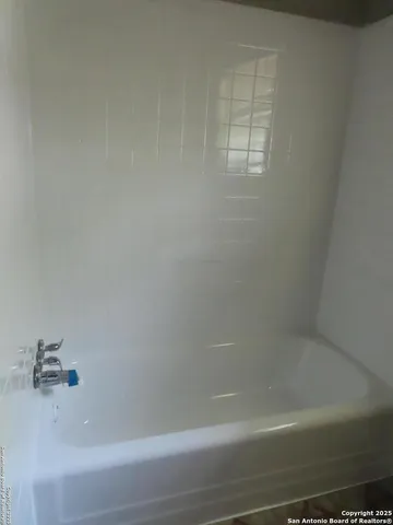 a bathroom with a bathtub