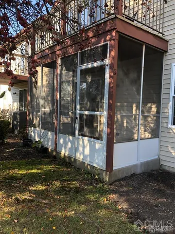 a view of a small house with yard