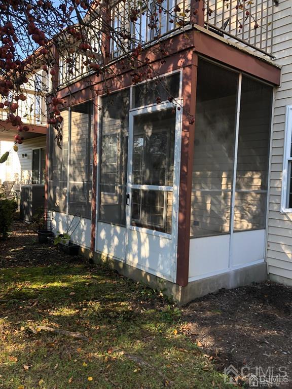 126 Concordia Circle, Unit G Monroe Township, NJ 08831 - Photo 14 of 14 a view of a small house with yard