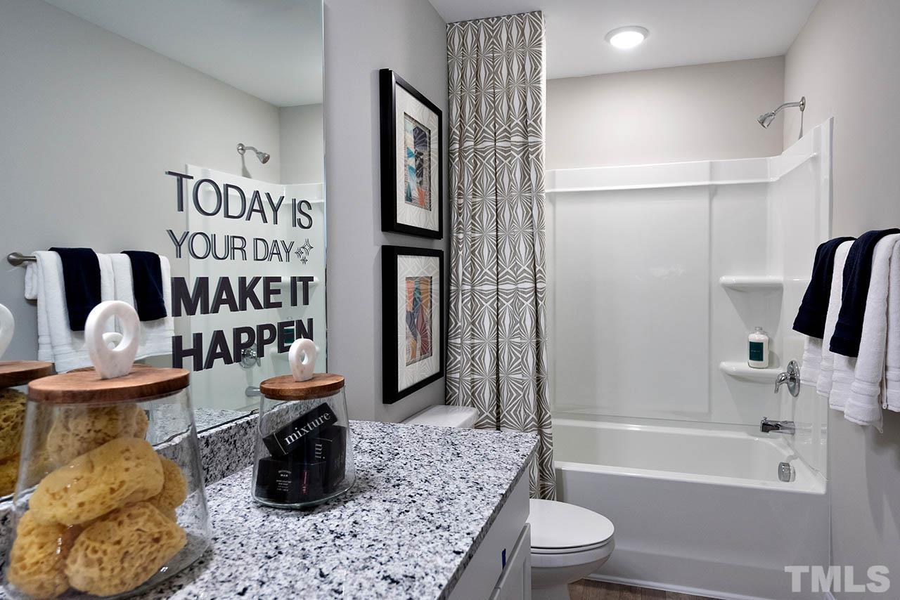 6932 Leesville Road, Unit 7 Raleigh, NC 27613 - Photo 38 of 44 a bathroom with a bathtub sink and toilet