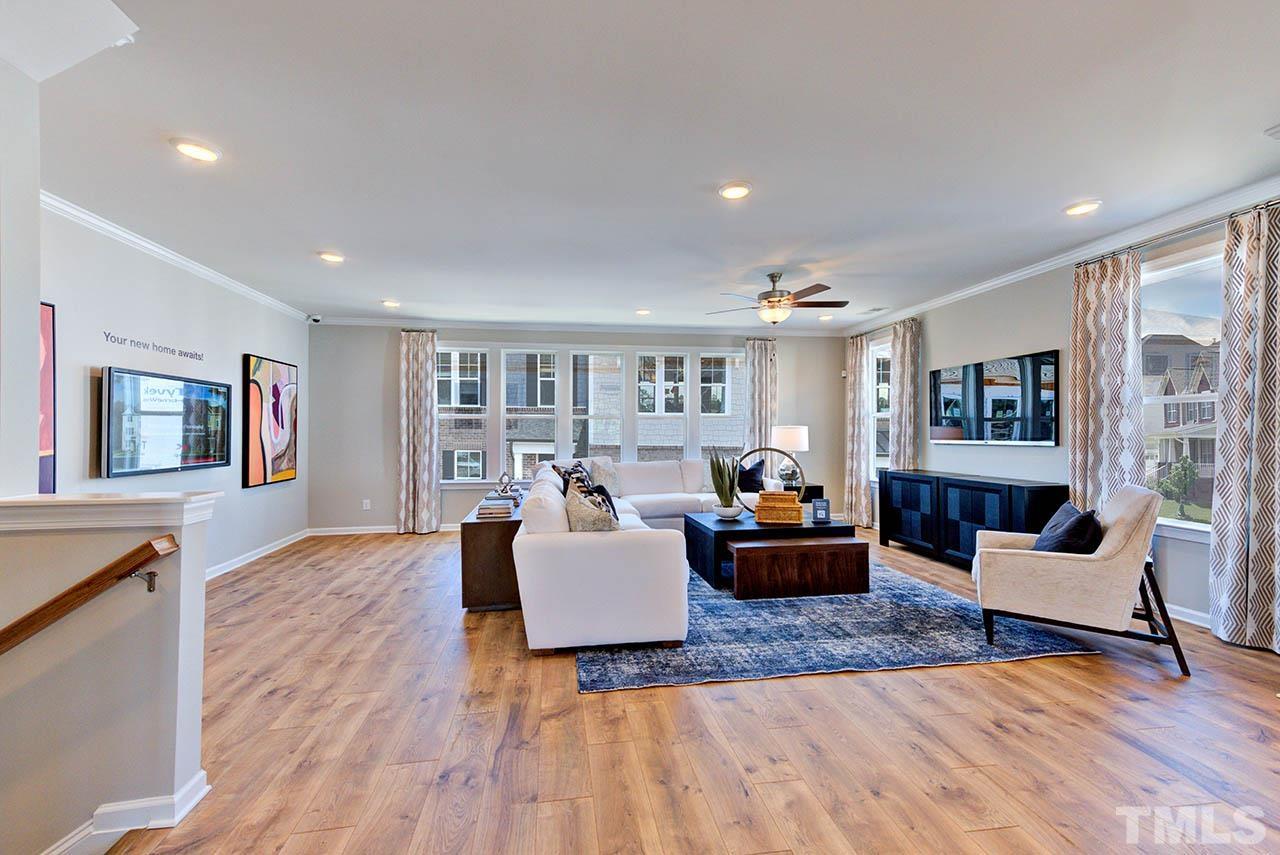 6932 Leesville Road, Unit 7 Raleigh, NC 27613 - Photo 10 of 44 a living room with furniture and wooden floor