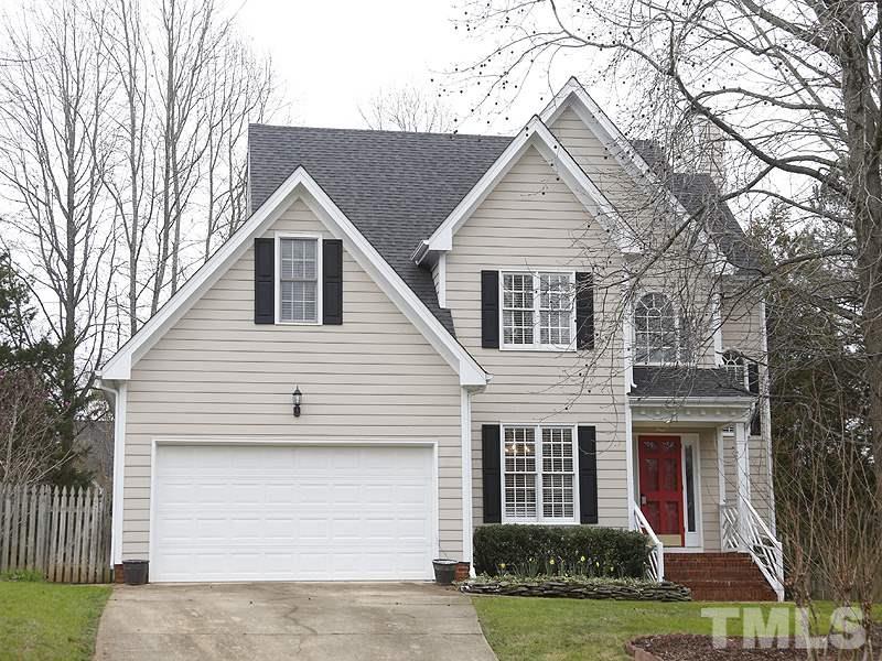 9112 Cub Trail Raleigh, NC 27615 - Photo 1 of 13 a front view of a house with garden