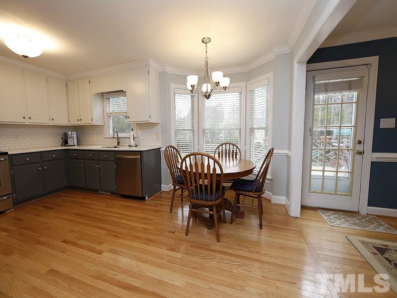9112 Cub Trail Raleigh, NC 27615 - Photo 6 of 13 a view of a dining room with furniture and chandelier