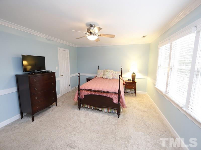 9112 Cub Trail Raleigh, NC 27615 - Photo 7 of 13 a bedroom with bed and tv