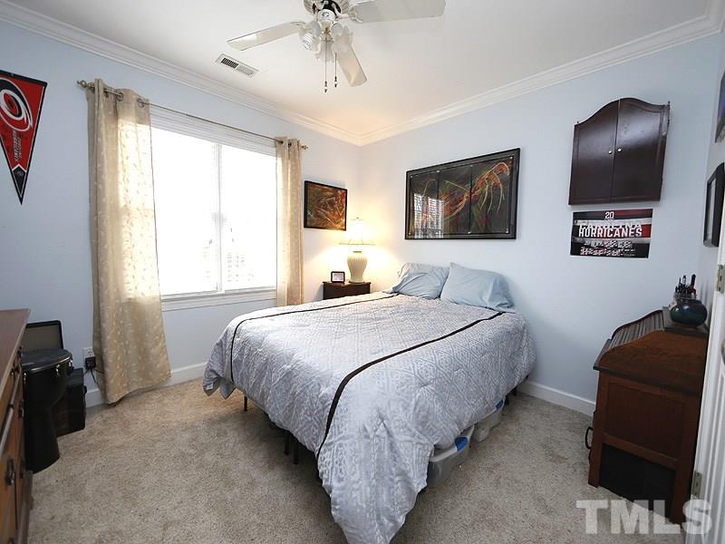 9112 Cub Trail Raleigh, NC 27615 - Photo 10 of 13 a bedroom with bed and window