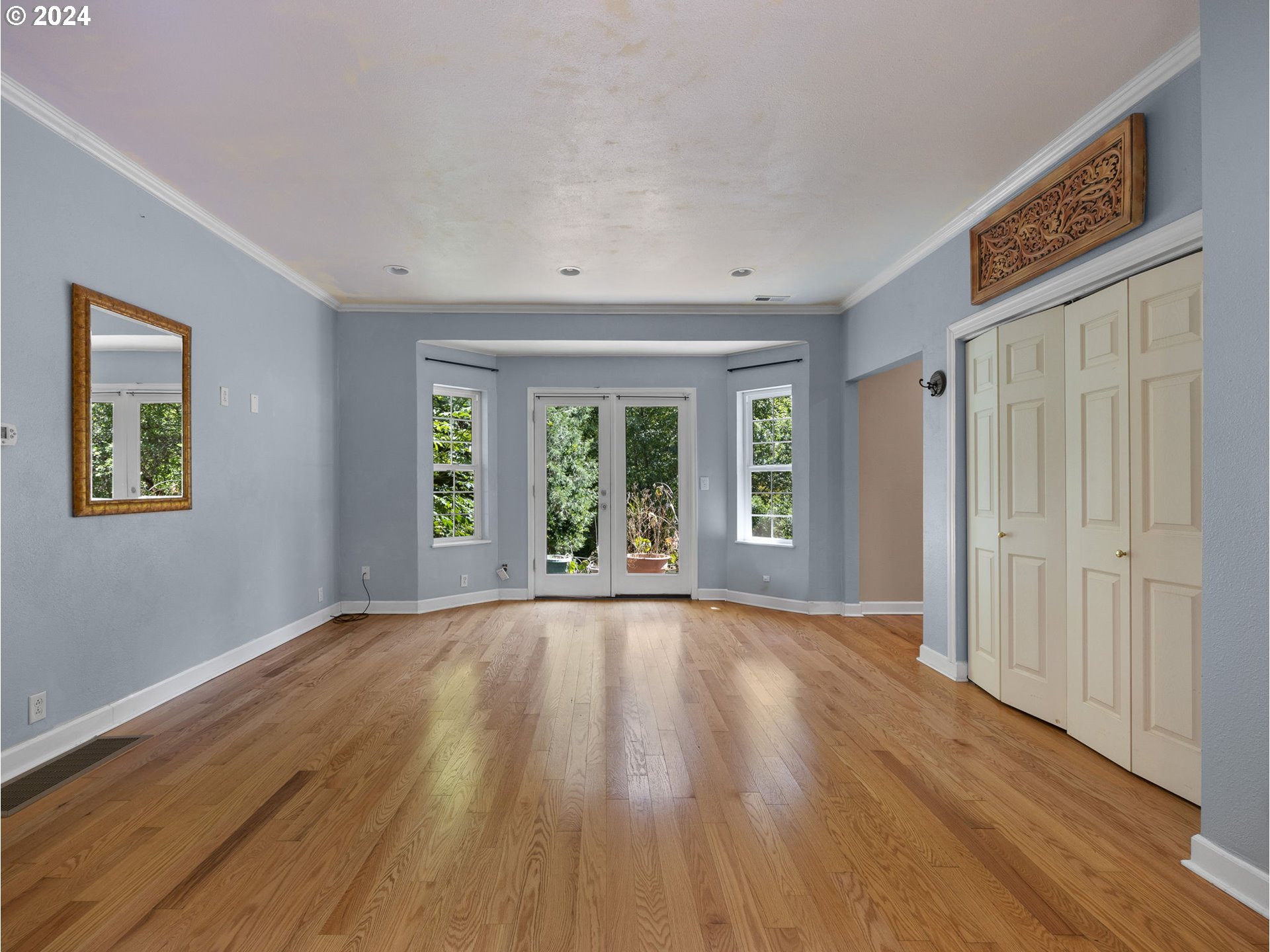 38631 Southeast Hudson Road Boring, OR 97009 - Photo 12 of 39 a view of an empty room with wooden floor and a window